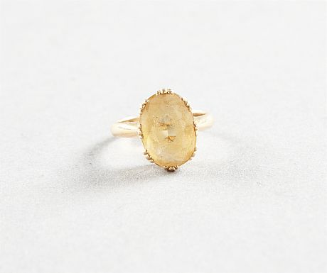 Ring i 18 k guld gul sten